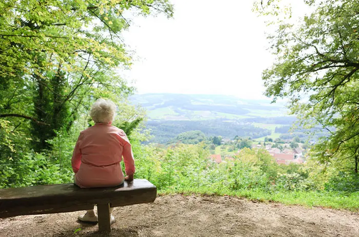 Woman sitting on bench alone