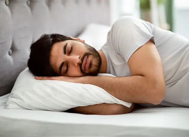 Man sleeping in bed