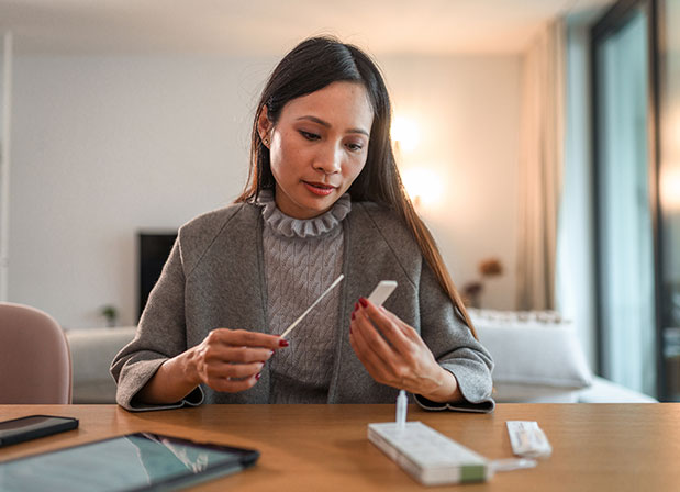 Woman taking at-home Covid-19 test