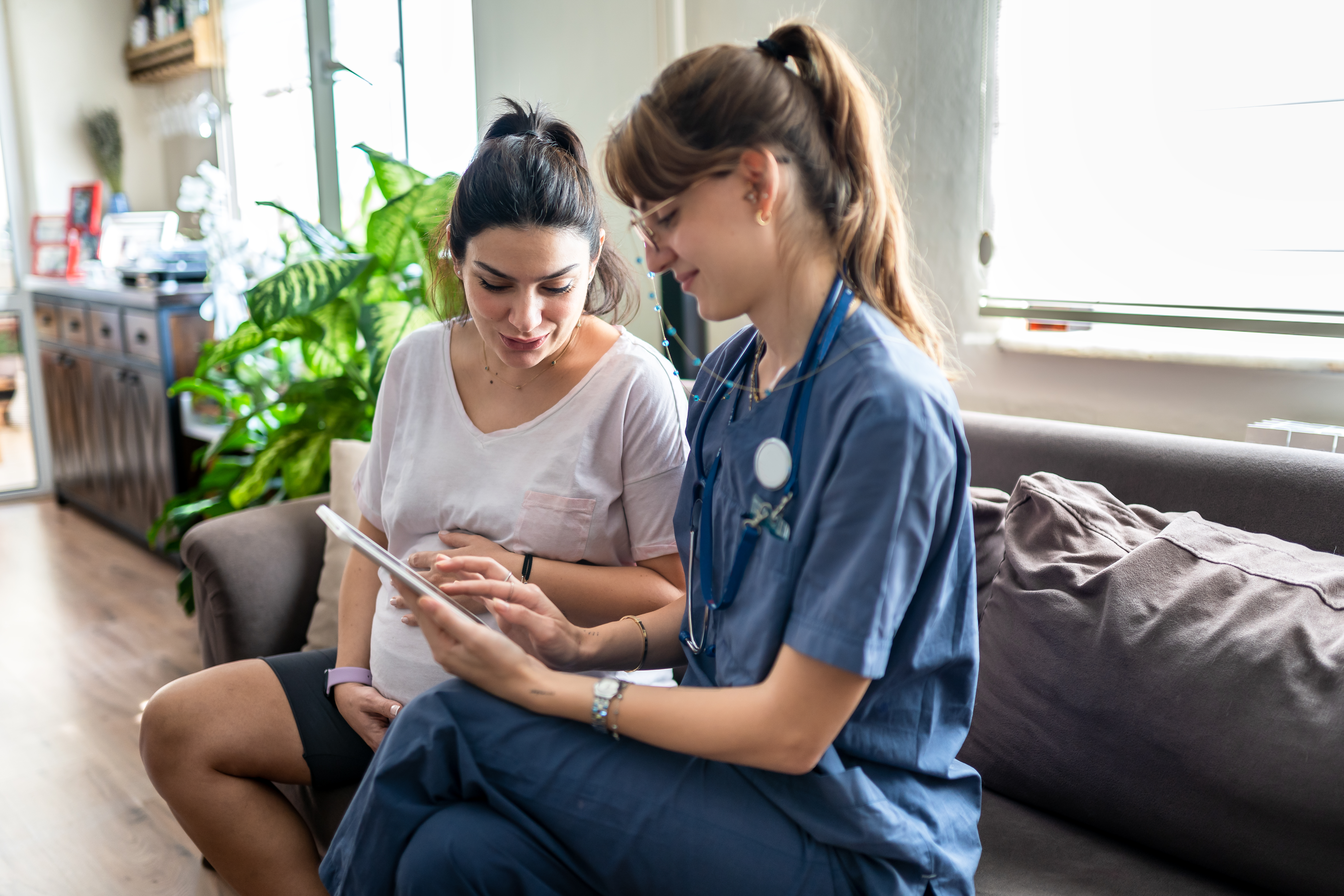 Pregnant woman with health care professional